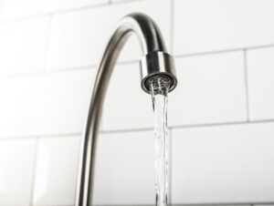 new and modern steel faucet in the kitchen