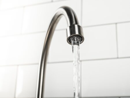 new and modern steel faucet in the kitchen