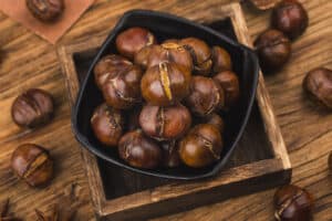 chestnuts on wooden background