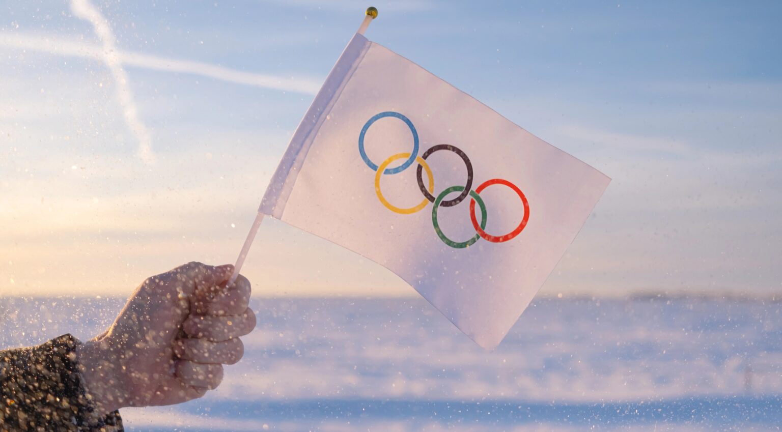 jeux olympiques hiver vue d'illustration d'un drapeau brandi devant la glace